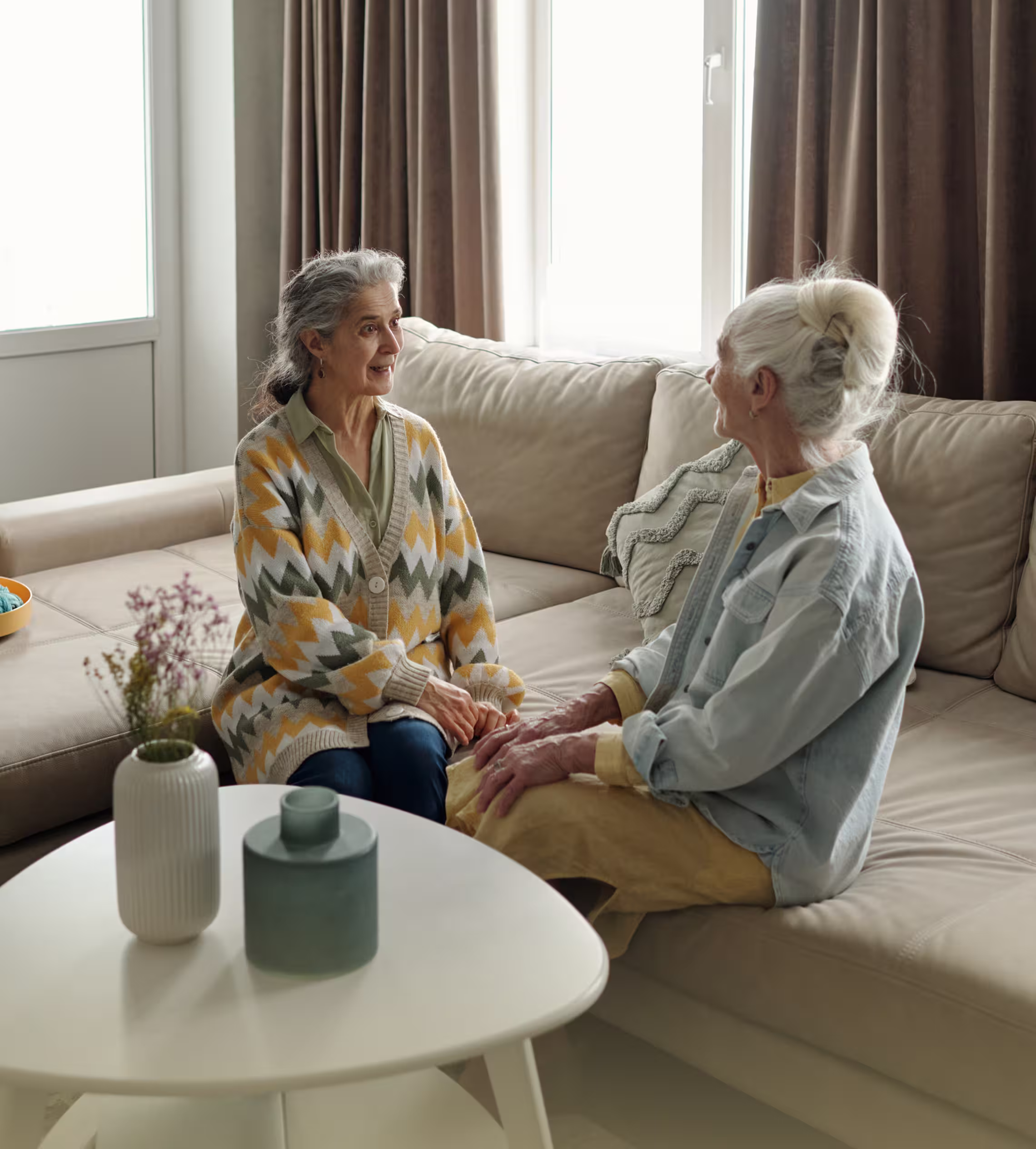 Senior residents enjoying conversation in Premier Living lounge
