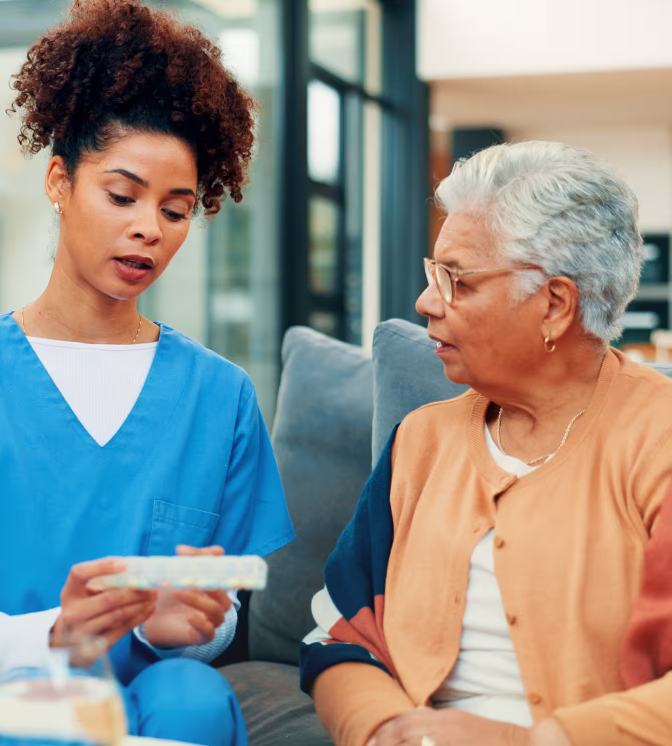 Caregiver assisting senior resident in Premier Living